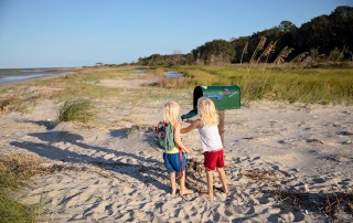 kids at a beach mailbox