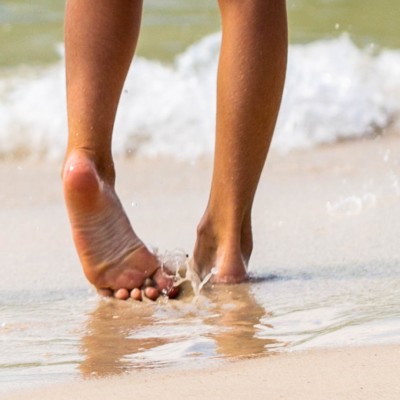 bare feet in the surf